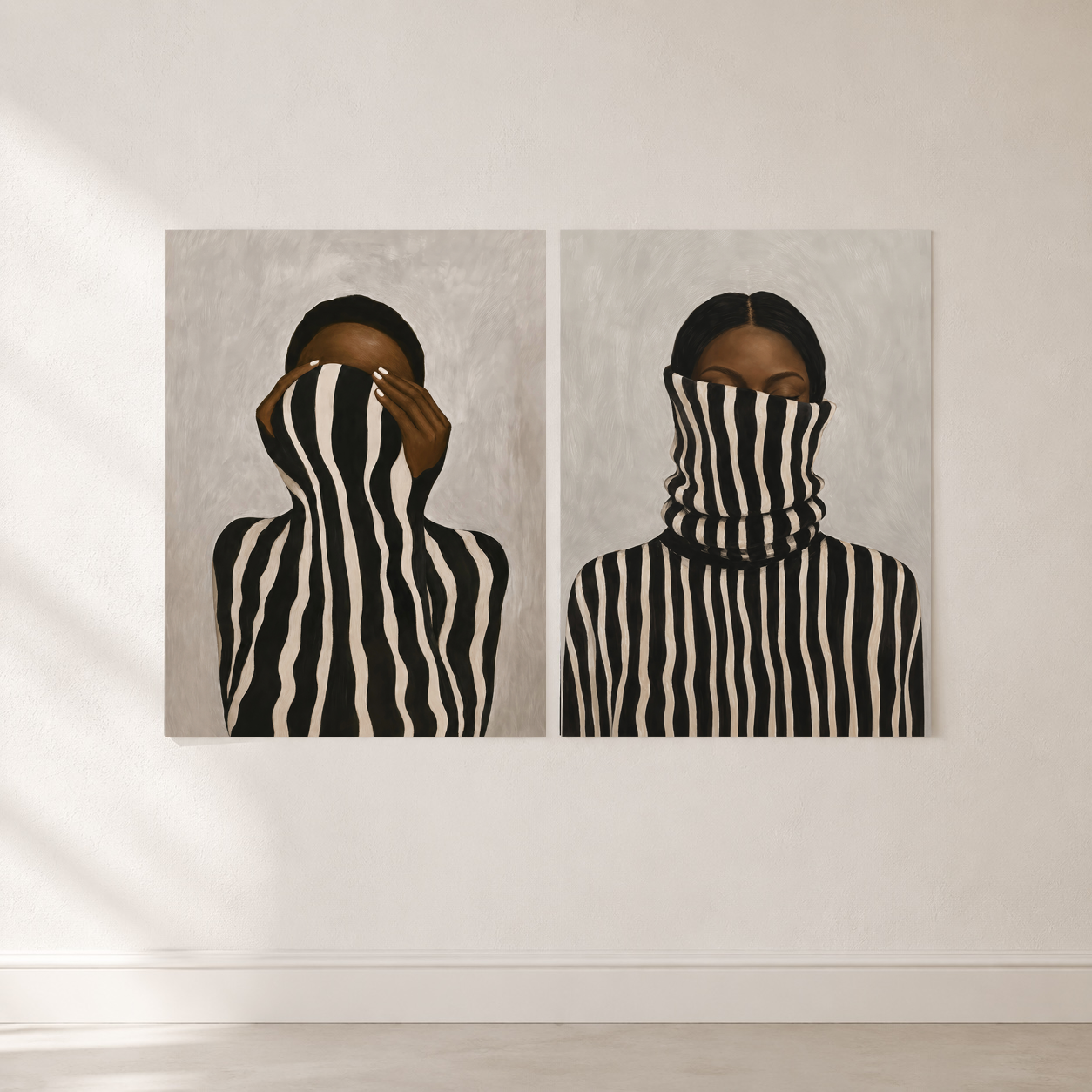 Set of two Black woman portrait posters displayed in a neutral modern living room.