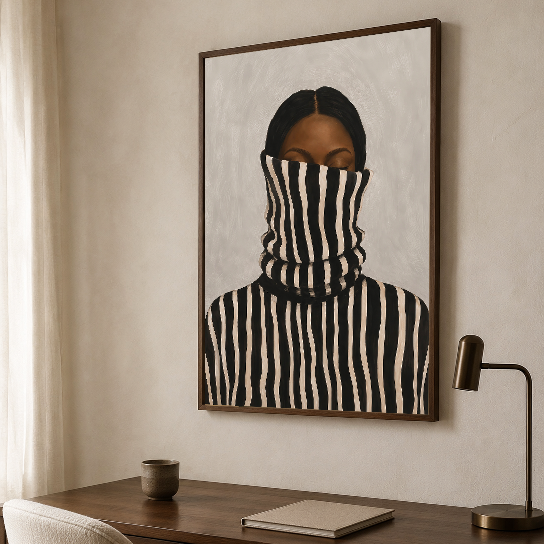 Framed striped portrait art print of a Black woman displayed above a desk in a neutral modern home office