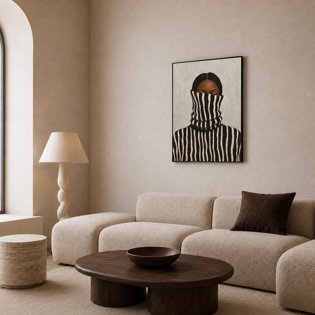 Black woman abstract and neutral portrait displayed above a beige sofa in a minimalist living room