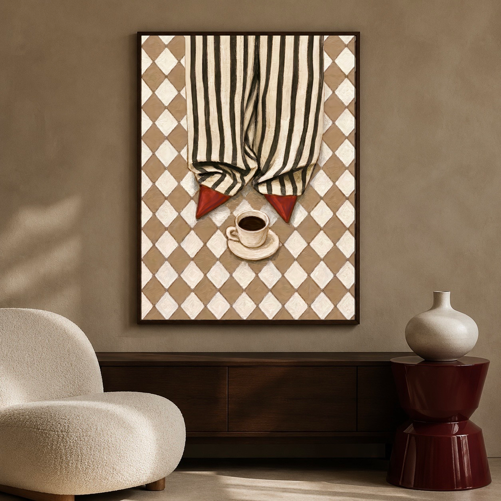 Framed red shoes and coffee poster displayed above a dark wooden sideboard beside a cream boucle chair