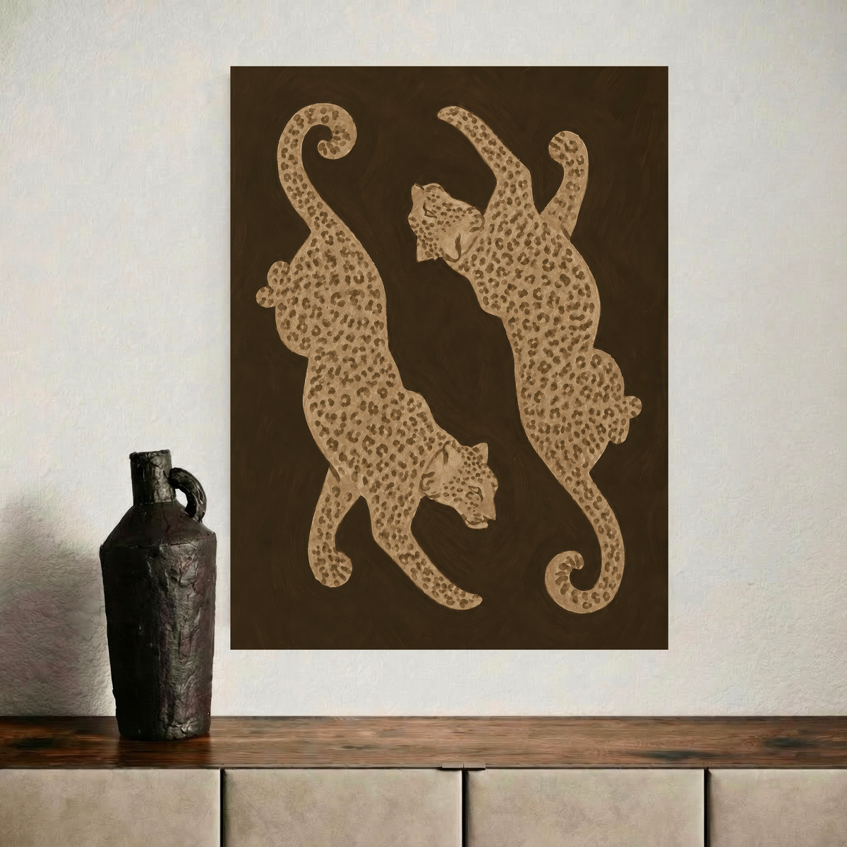 Close view of a brown and beige leopard art print displayed above a wooden sideboard
