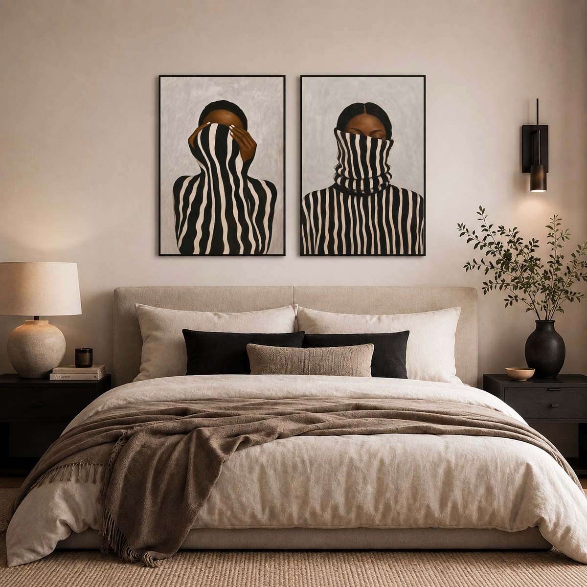 Black and white portrait poster set of two displayed above a bed in a warm modern bedroom
