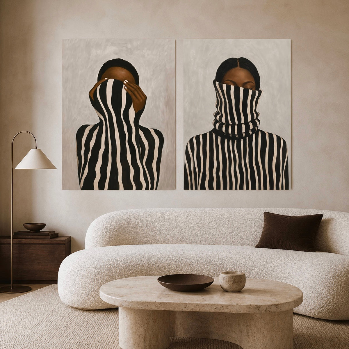 Afrocentric wall art set of two featuring striped female portraits above a cream sofa