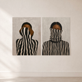 Minimalist set of two striped female portrait posters on a light neutral wall.
