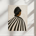 Modern wall art print of a Black woman seen from behind, featuring bold black and white stripes  in a minimalist composition.