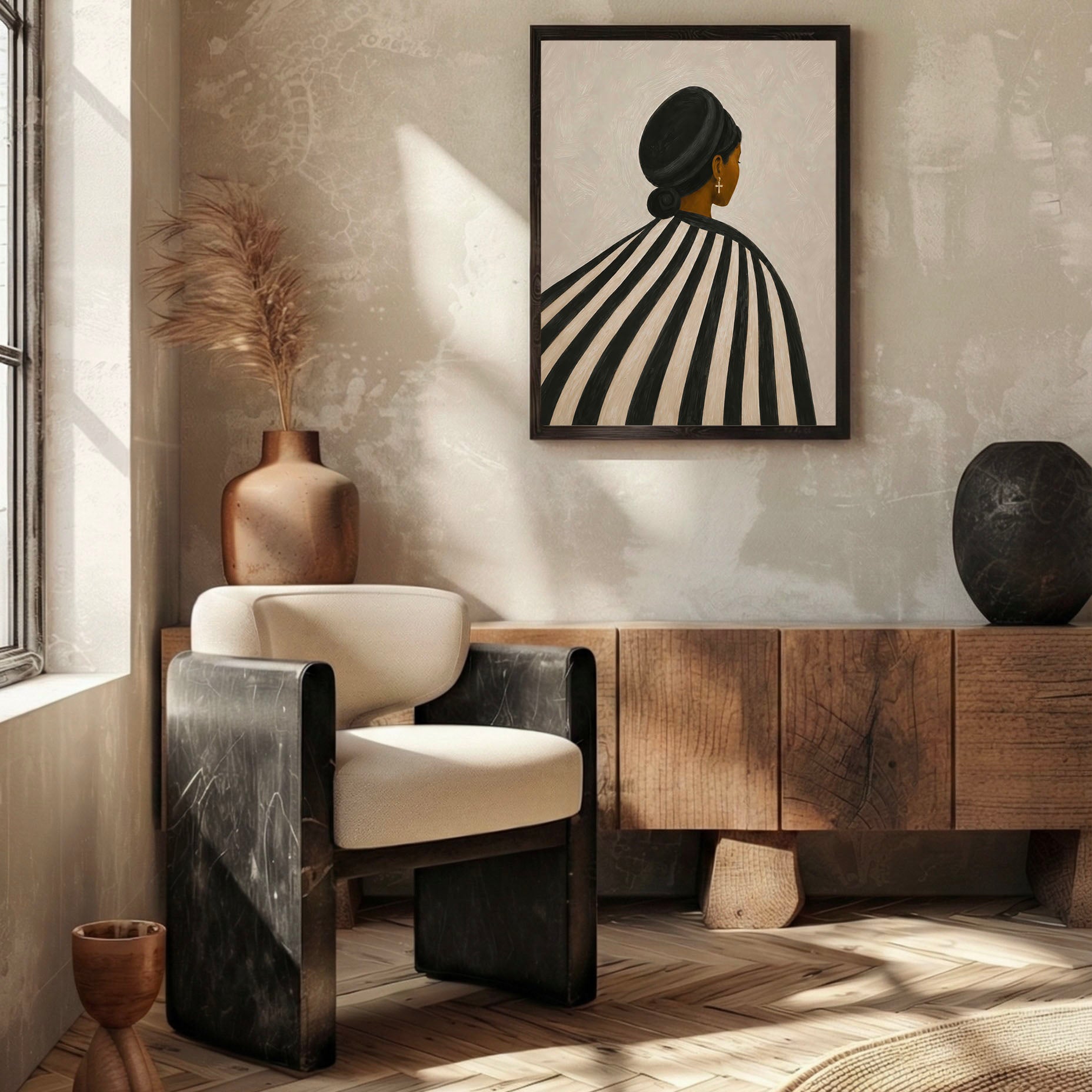 Black woman wall art styled above a wooden sideboard in a beige living room