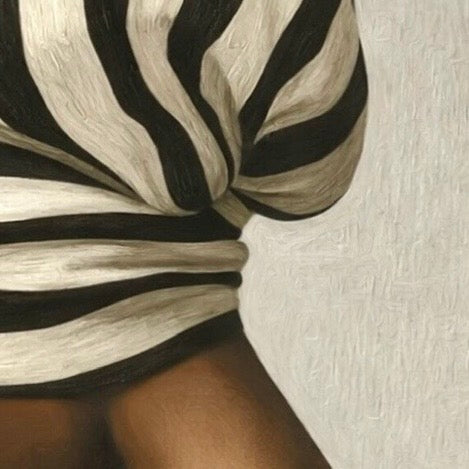 Close‑up of the zebra‑striped wrap showing curved black and white stripes on fabric.